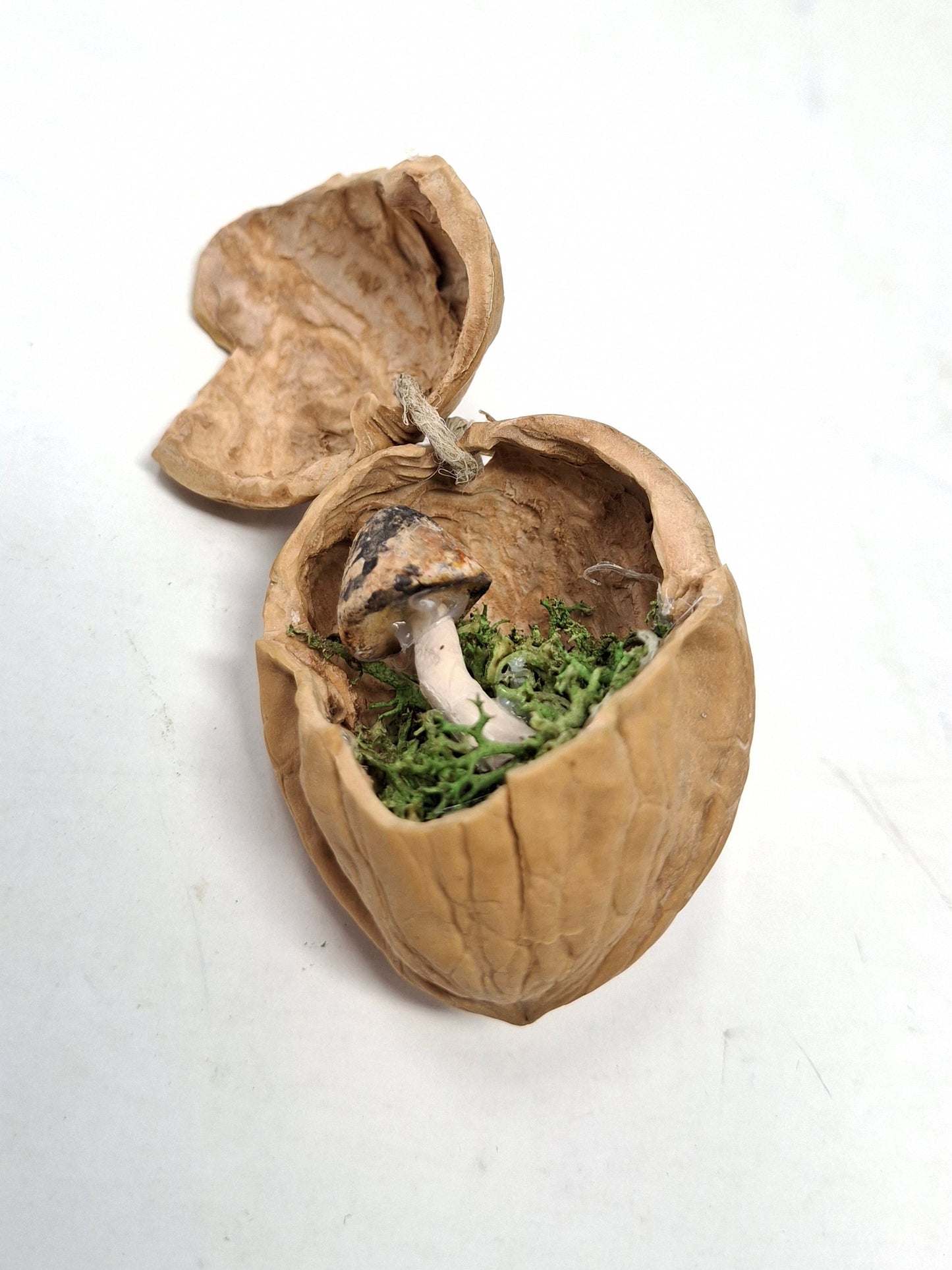 Walnut ornaments with hidden mushrooms